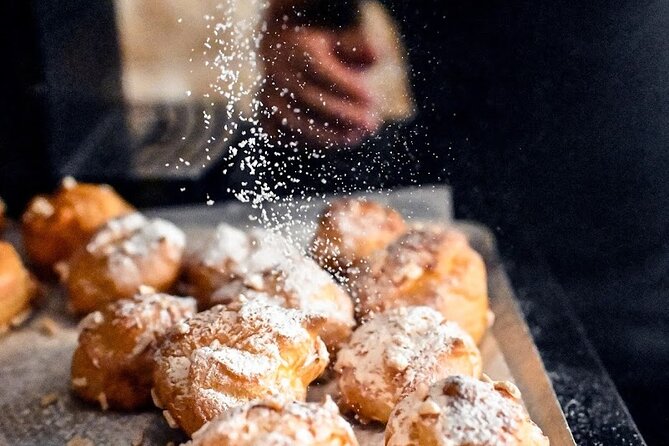 Authentic Parisian Gourmet Food Tour with 10 Local Dishes & Wines - Notre Dame: pastries, oysters, galettes, and old streets