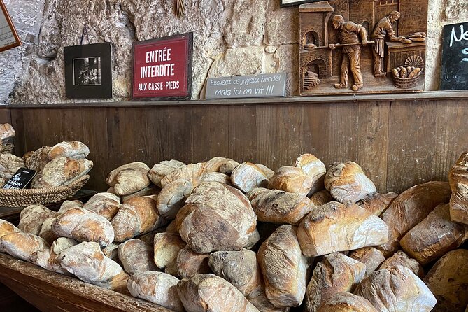 Bordeaux Old Town Food and Wine Tour - Fromagerie, butcher, and cannelé shop