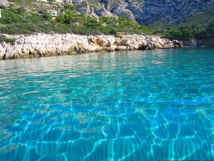 From Marseille: Iconic Calanques Boat Tour with Swimming - Boat comfort, spray, and the no-toilet warning