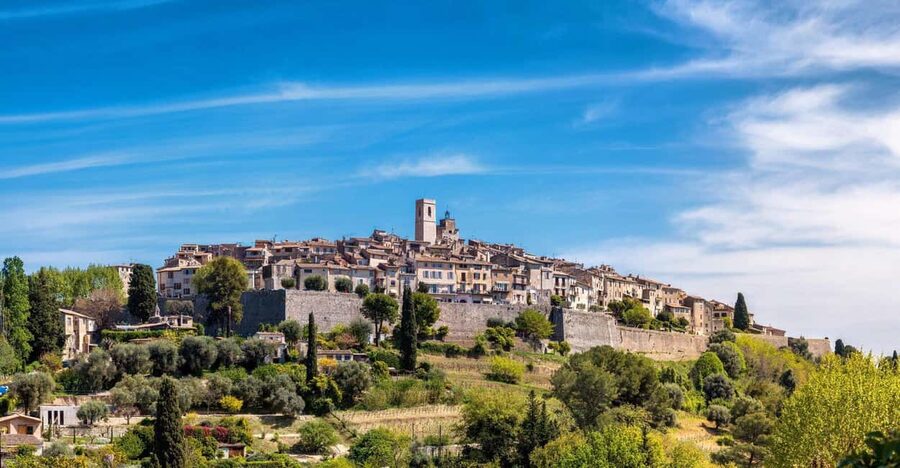 From Nice: Cannes, Saint Paul de Vence and Wine Tasting - Antibes: market stalls, old walls, and millionaire yachts