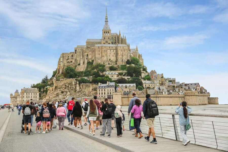 From Paris: Mont Saint-Michel Tour with Hotel Pickup Service - Inside the 11th-century abbey