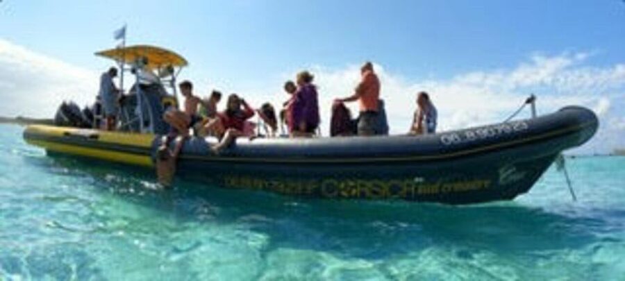 From Santa Giulia SUNSET Cruise & Apéritif - Santa Giulia Beach is the starting point