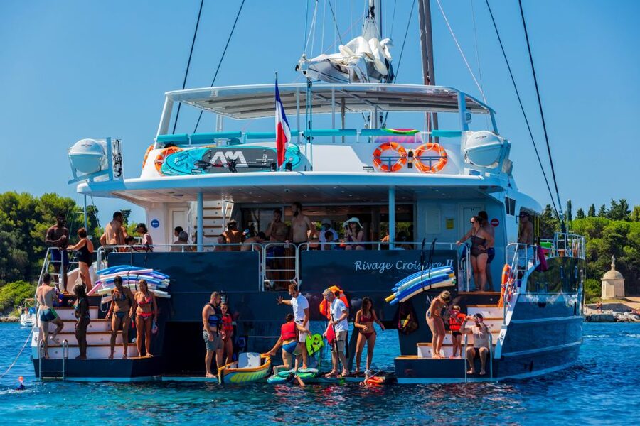 Full-Day Catamaran Cruise Departing from Cannes - Leaving Cannes through the old port