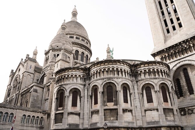 Hidden Montmartre: Paris' Secret Streets Walking Tour - Moulin de la Galette and the quiet passage