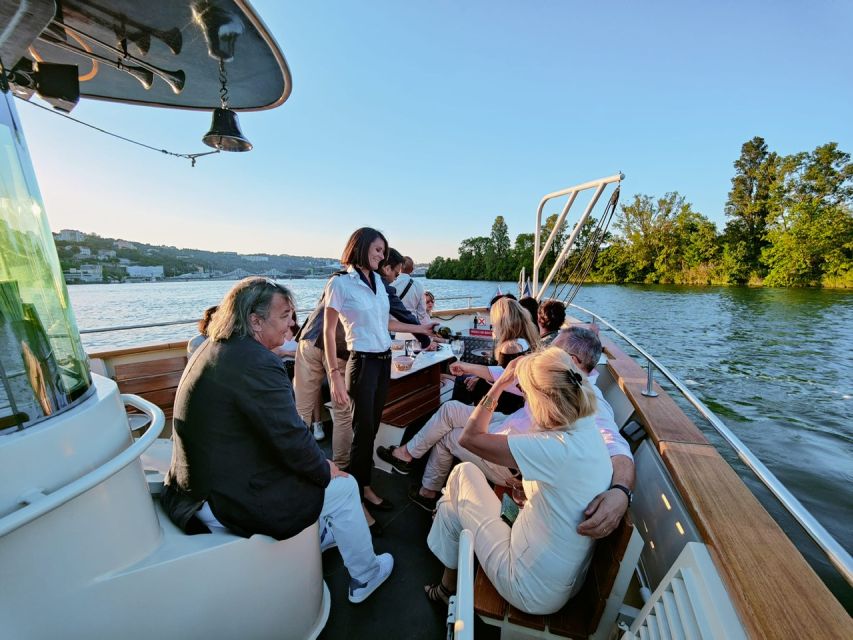 Lyon: City Cruise with Charcuterie, Cheese, and Wine - Lyon from the water, with a plate in front of you