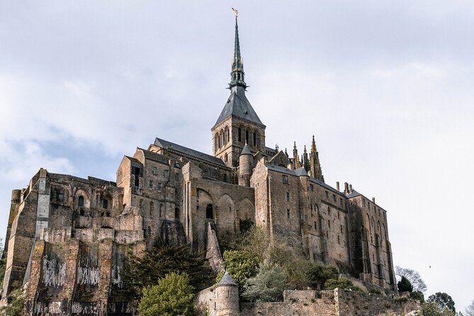 Mont Saint Michel Full Day Tour from Bayeux - Inside the abbey, from pilgrimage center to prison