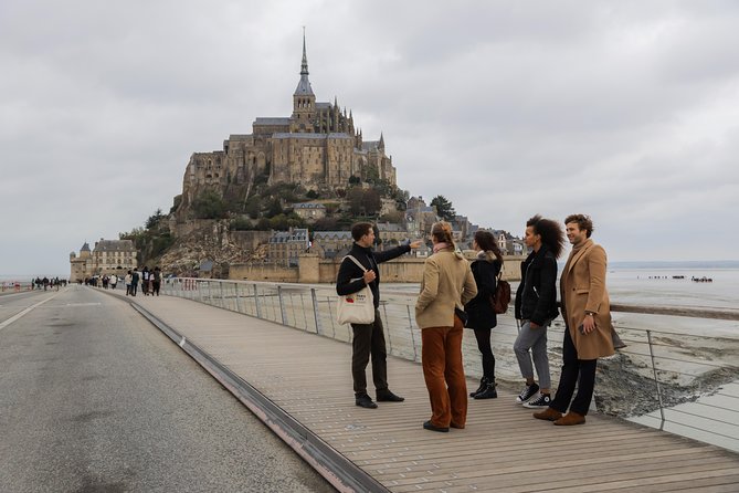 Mont Saint Michel Guided Day Trip with Abbey Entry from Paris - Arriving at the Island and Climbing Through the Village