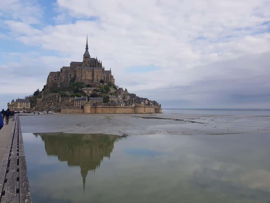 Mont Saint Michel: Village History and Legends Walking Tour - Crossing the bridge or taking the free shuttle