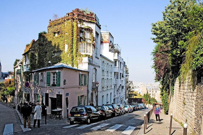 Montmartre Hidden Gems and Scenic Highlights Walking Tour - Moulin de la Galette and the neighborhood’s old pleasure life