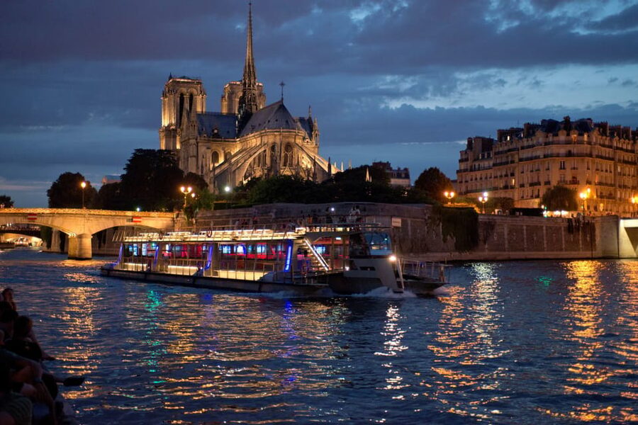 Paris: Eiffel Tower Dinner Cruise with a Moulin Rouge Show - Eiffel Tower views after sunset