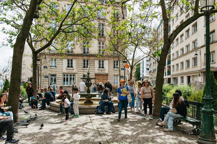 Paris: Emily TV Show Locations Guided Walking Tour - Crossing the Pont des Arts