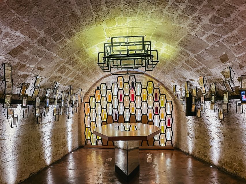 Paris: Les Caves du Louvre Guided Tour with Wine Tastings - From grapes to bottles, the tour explains the process