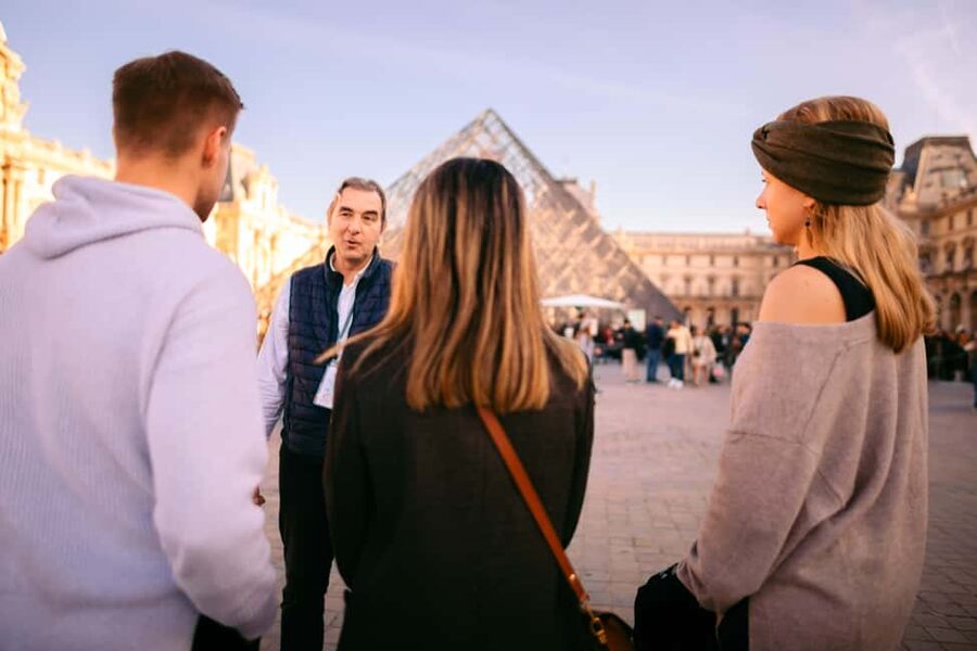 Paris Louvre Exclusive Semi Private Guided Tour Max 6 People - The Louvre Pyramid and the first sense of scale