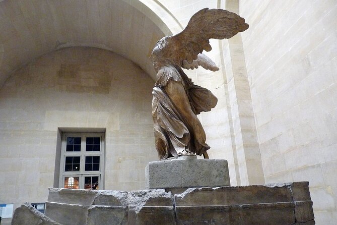 Paris: Louvre Museum Tour Mona Lisa & Iconic Masterpieces - Entering through the Louvre pyramid