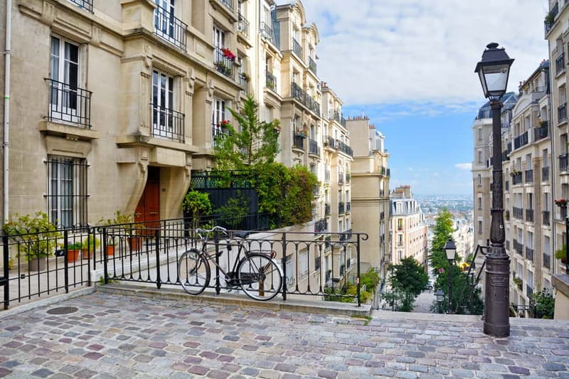 Paris: Montmartre Hidden Gems and Highlights Walking Tour - Rue des Abbesses, food, and Montmartre’s village feel