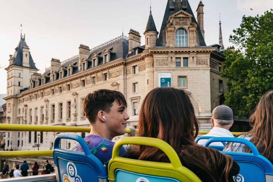 Paris: Night Bus Tour with Audioguide - The Louvre departure gives the ride a grand opening