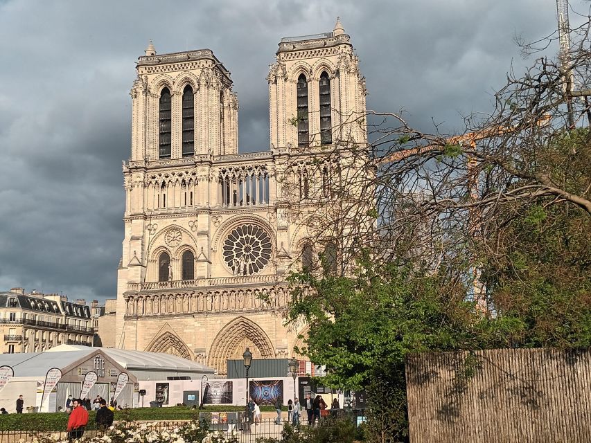 Paris: Notre Dame Exterior Walking Tour with Sainte Chapelle - Place Dauphine, a quiet royal square