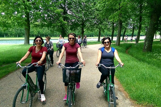 Versailles Domain Bike Tour with Palace Entry by Train from Paris - Riding and walking beside the Grand Canal